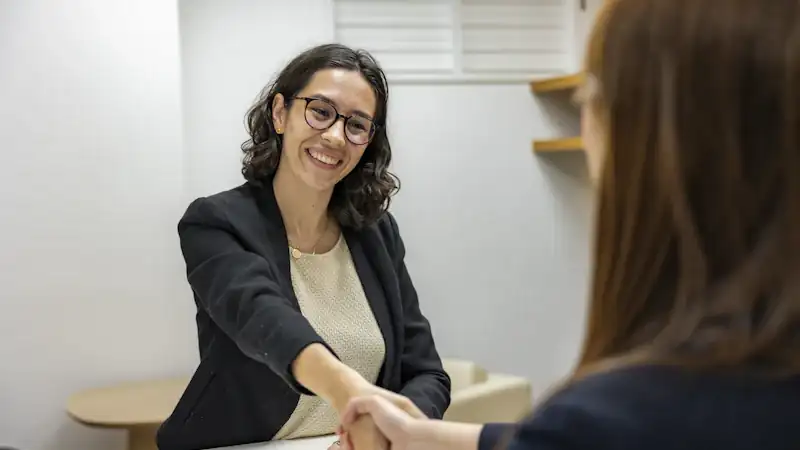 Recruiter shaking hands with a candidate after an interview